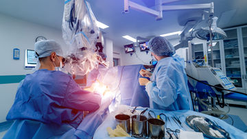 Brain Catheter - Surgeons in Operating Room
